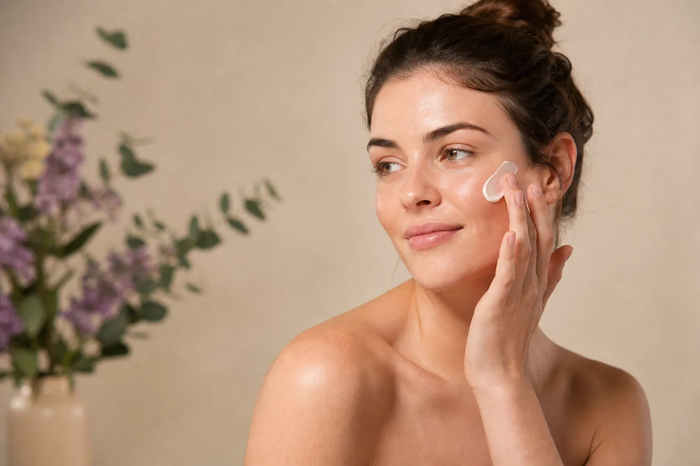 Woman with light skin applying moisturizer